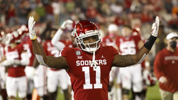 Nov 21, 2020; Norman, Oklahoma, USA; Oklahoma Sooners linebacker Nik Bonitto (11) reacts at the end of the first half against the Oklahoma State Cowboys at Gaylord Family-Oklahoma Memorial Stadium. Mandatory Credit: Kevin Jairaj-USA TODAY Sports