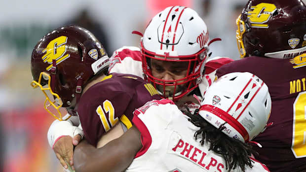 Miami (Ohio) RedHawks defensive lineman Lonnie Phelps sacks Central Michigan Chippewas quarterback Quinten Dormady during the first half of the MAC championship game Saturday, Dec. 7, 2019 at Ford Field in Detroit. Mac