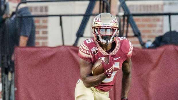 Florida State Seminoles running back Corey Wren (16) runs the ball down the field. The Notre Dame Fighting Irish lead the Florida State Seminoles 17-14 at the half Sunday, Sept. 5, 2021.