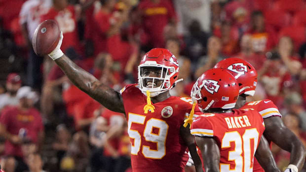 Aug 27, 2021; Kansas City, Missouri, USA; Kansas City Chiefs defensive end Joshua Kaindoh (59) celebrates after an interception against the Minnesota Vikings during the second half at GEHA Field at Arrowhead Stadium. Mandatory Credit: Denny Medley-USA TODAY Sports