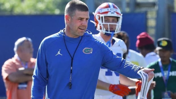 Florida Gators head coach Billy Napier instructs players at a practice during the college football season.