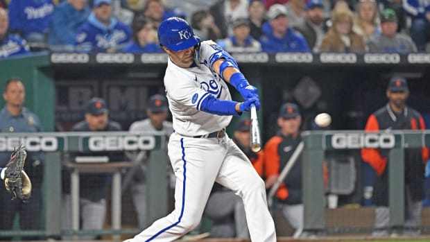 Apr 14, 2022; Kansas City, Missouri, USA; Kansas City Royals right fielder Whit Merrifield (15) hits an RBI single during the fourth inning against the Detroit Tigers at Kauffman Stadium. Mandatory Credit: Peter Aiken-USA TODAY Sports