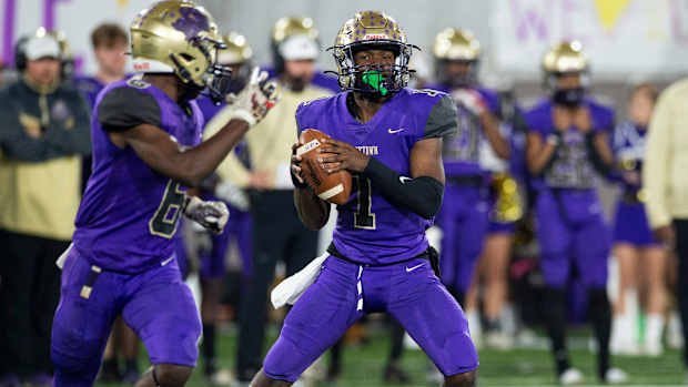 Hueytown's Earl Woods (1) looks to pass during the Class 6A football state championship at Protective Stadium in Birmingham, Ala., on Friday, Dec. 3, 2021. Clay-Chalkville leads Hueytown 22-14 at halftime.