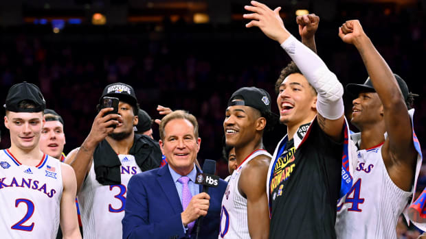 Apr 4, 2022; New Orleans, LA, USA; CBS announcer Jim Nantz interviews Kansas Jayhawks guard Ochai Agbaji (30) after their win against the North Carolina Tar Heels in the 2022 NCAA men's basketball tournament Final Four championship game at Caesars Superdome.
