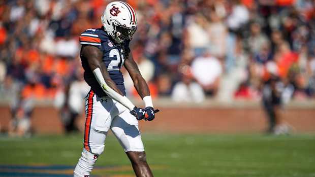 Auburn Tigers safety Smoke Monday (21) celebrates a pass breakup against Mississippi State at Jordan-Hare Stadium in Auburn, Ala., on Saturday, Nov. 13, 2021. Aumsu03