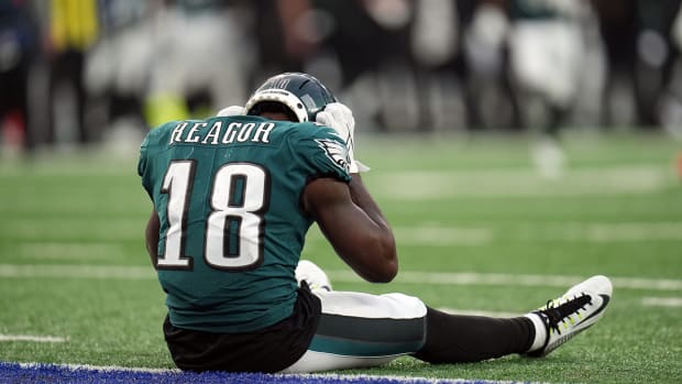 Jalen Reagor sitting on the field for the Eagles.