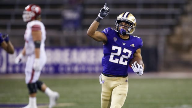 Nov 28, 2020; Seattle, Washington, USA; Washington Huskies defensive back Trent McDuffie (22) celebrates following an interception against the Utah Utes during the fourth quarter at Alaska Airlines Field at Husky Stadium. Mandatory Credit: Joe Nicholson-USA TODAY Sports