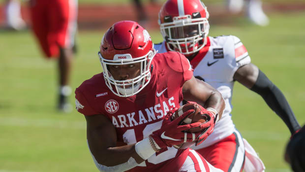 Arkansas Razorbacks wide receiver Treylon Burks (16) gets past Georgia Bulldogs defensive back Richard LeCounte (2) and goes on to score a touchdown during the first quarter at Donald W. Reynolds Razorback Stadium. Georgia won the game 37-10.