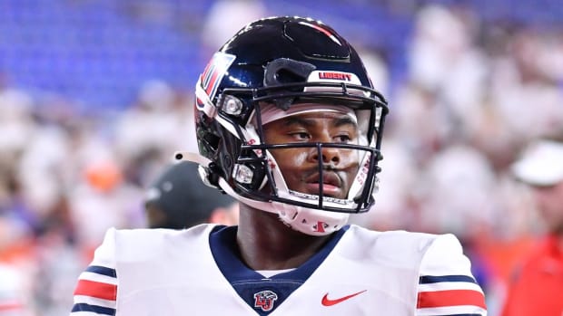 Liberty Flames quarterback Malik Willis (7) warms up before a game against the Syracuse Orange at the Carrier Dome.