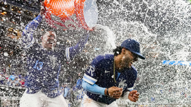 May 3, 2022; Kansas City, Missouri, USA; Kansas City Royals designated hitter MJ Melendez (1) is doused with water by Kansas City Royals catcher Salvador Perez (13) after defeating the St. Louis Cardinals at Kauffman Stadium. Mandatory Credit: Jay Biggerstaff-USA TODAY Sports