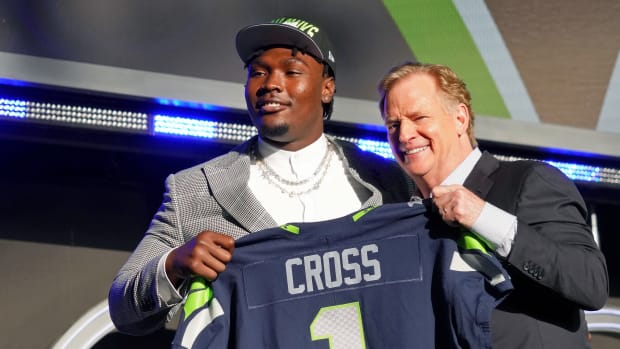 Mississippi State offensive tackle Charles Cross with NFL commissioner Roger Goodell after being selected as the ninth overall pick to the Seattle Seahawks during the first round of the 2022 NFL Draft at the NFL Draft Theater.
