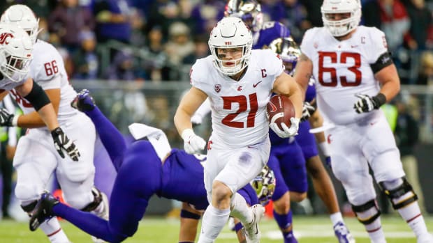 Nov 26, 2021; Seattle, Washington, USA; Washington State Cougars running back Max Borghi (21) rushes against the Washington Huskies during the second quarter at Alaska Airlines Field at Husky Stadium. Mandatory Credit: Joe Nicholson-USA TODAY Sports