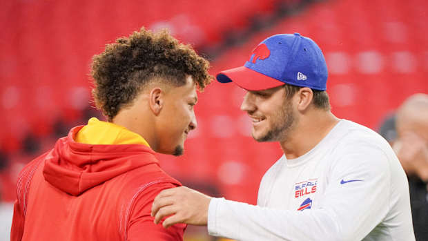 Oct 10, 2021; Kansas City, Missouri, USA; Kansas City Chiefs quarterback Patrick Mahomes (15) talks with Buffalo Bills quarterback Josh Allen (17) before warm ups at GEHA Field at Arrowhead Stadium. Mandatory Credit: Denny Medley-USA TODAY Sports