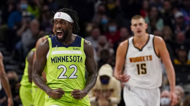 Minnesota Timberwolves guard Patrick Beverley (22) reacts after a basket by forward Anthony Edwards (not pictured) against the Denver Nuggets during the second quarter at Target Center.