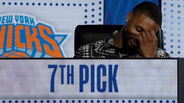 Portland Trailblazer Damian Lillard reacts after getting the seventh pick during the 2022 NBA Draft Lottery.
