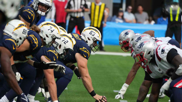 Oct 31, 2021; Inglewood, California, USA; A general overall view of the line of scrimmage as Los Angeles Chargers center Corey Linsley (63) snaps the ball against the New England Patriots at SoFi Stadium. The Patriots defeated the Chargers 27-24. Mandatory Credit: Kirby Lee-USA TODAY Sports
