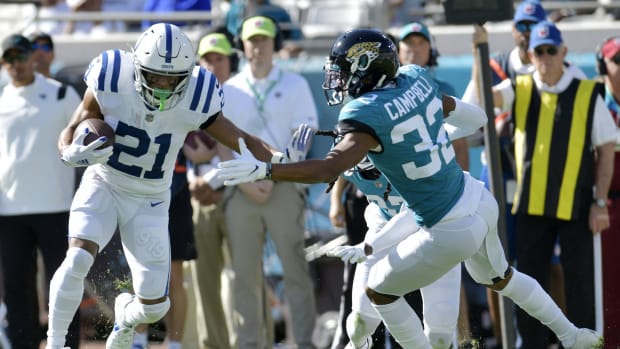 Jacksonville Jaguars cornerback Tyson Campbell (32) tries to get a hand on Indianapolis Colts running back Nyheim Hines (21) on a second quarter pass play. The Jacksonville Jaguars hosted the Indianapolis Colts at TIAA Bank Field in Jacksonville, Florida for the Jaguars final game of the season Sunday, January 9, 2022. The Jaguars finished out their season with a 26 to 11 victory over the Colts. [Bob Self/Florida Times-Union] Jki 010922 Bsjaguarsvscolt 25