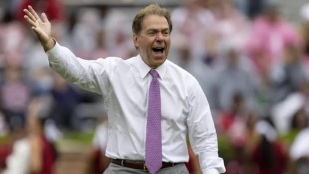 Ex-Alabama Crimson Tide head coach Nick Saban addresses his team during a college football game in the SEC.