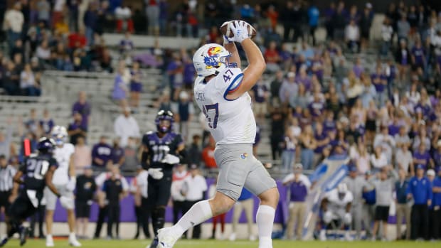 Nov 20, 2021; Fort Worth, Texas, USA; Kansas Jayhawks fullback Jared Casey (47) makes a 10-yard touchdown catch against the TCU Horned Frogs during the second half at Amon G. Carter Stadium. Mandatory Credit: Raymond Carlin III-USA TODAY Sports