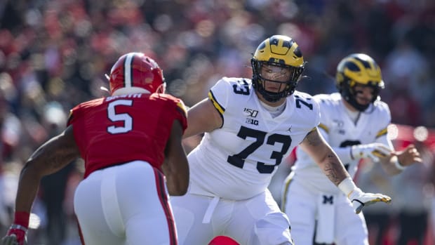Nov 2, 2019; College Park, MD, USA; Michigan Wolverines offensive lineman Jalen Mayfield (73) blocks Maryland Terrapins linebacker Shaq Smith (5) during the first half at Capital One Field at Maryland Stadium. Mandatory Credit: Tommy Gilligan-USA TODAY Sports