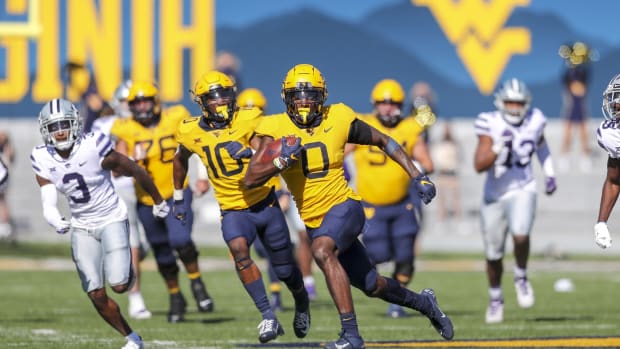 Oct 31, 2020; Morgantown, West Virginia, USA; West Virginia Mountaineers wide receiver Bryce Ford-Wheaton (0) runs after a catch during the second quarter against the Kansas State Wildcats at Mountaineer Field at Milan Puskar Stadium