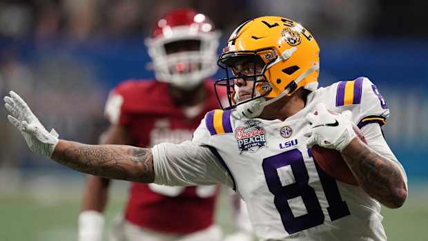 Dec 28, 2019; Atlanta, Georgia, USA; LSU Tigers tight end Thaddeus Moss (81) runs after a pass reception against the Oklahoma Sooners during the second quarter of the 2019 Peach Bowl college football playoff semifinal game. Mandatory Credit: John David Mercer-USA TODAY Sports