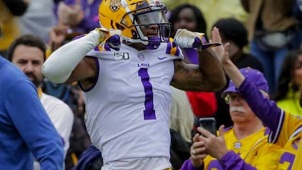 Oct 26, 2019; Baton Rouge, LA, USA; LSU Tigers wide receiver Ja'Marr Chase (1) reacts after a reception against the Auburn Tigers during the first half at Tiger Stadium. Mandatory Credit: Derick E. Hingle-USA TODAY Sports