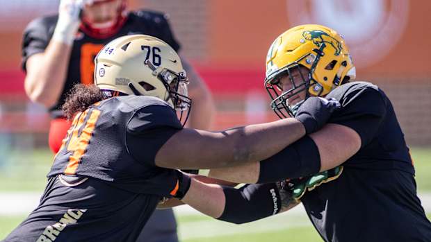 Jan 28, 2021; National offensive lineman Jaylon Moore of Western Michigan (74) drills with National offensive lineman Dillon Radunz of North Dakota State (75) during National practice at Hancock Whitney Stadium in Mobile, Alabama, USA; Mandatory Credit: Vasha Hunt-USA TODAY Sports