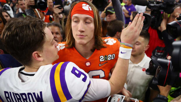 Jan 13, 2020; New Orleans, Louisiana, USA; Clemson Tigers quarterback Trevor Lawrence (right) greets LSU Tigers quarterback Joe Burrow following the College Football Playoff national championship game at Mercedes-Benz Superdome. Mandatory Credit: Mark J. Rebilas-USA TODAY Sports