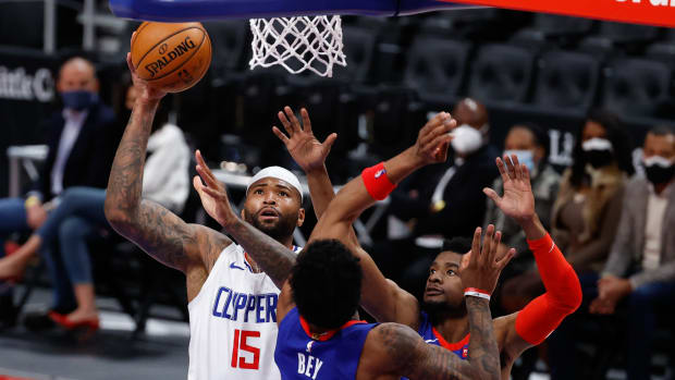 Apr 14, 2021; Detroit, Michigan, USA; LA Clippers center DeMarcus Cousins (15) shoots on Detroit Pistons forward Saddiq Bey (41) and guard Josh Jackson (20) in the second half at Little Caesars Arena. Mandatory Credit: Rick Osentoski-USA TODAY Sports