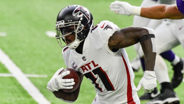 Oct 18, 2020; Minneapolis, Minnesota, USA; Atlanta Falcons wide receiver Julio Jones (11) runs with the ball against the Minnesota Vikings during the first quarter at U.S. Bank Stadium. Mandatory Credit: Jeffrey Becker-USA TODAY Sports