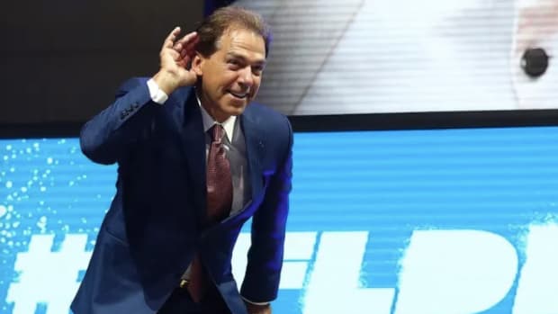 Nick Saban hears it from the crowd at the NFL draft