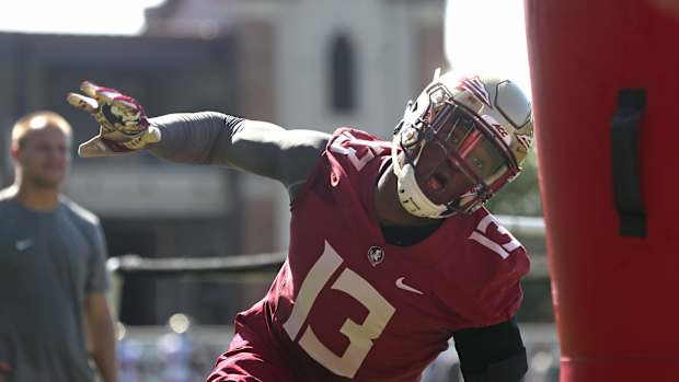 FSU's Joshua Kaindoh works out during their opening practice for fall camp at the Al Dunlap Training Facility Monday, Aug. 6, 2018. 636691563414364535-B49I3209.jpg