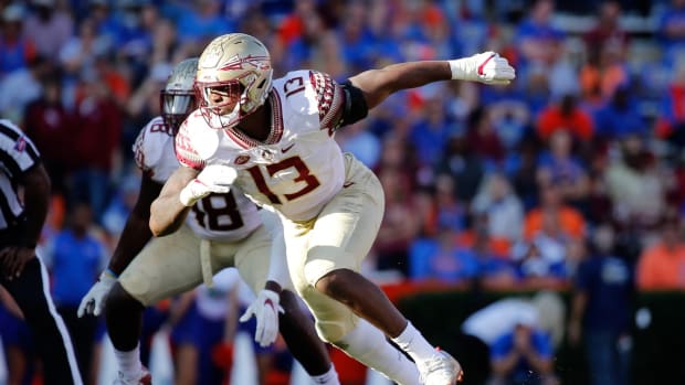 Nov 25, 2017; Gainesville, FL, USA; Florida State Seminoles defensive end Joshua Kaindoh (13) rushes during the second half at Ben Hill Griffin Stadium. Mandatory Credit: Kim Klement-USA TODAY Sports