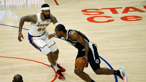 Apr 4, 2021; Los Angeles, California, USA; Los Angeles Lakers center Andre Drummond (2) moves the ball against Los Angeles Lakers forward Markieff Morris (88) during the first half at Staples Center. Mandatory Credit: Gary A. Vasquez-USA TODAY Sports