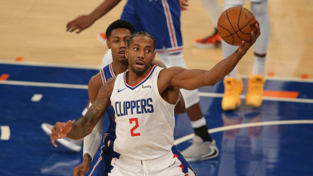 Jan 31, 2021; New York, New York, USA; LA Clippers small forward Kawhi Leonard (2) controls the ball against New York Knicks shooting guard RJ Barrett (9) during the second quarter at Madison Square Garden. Mandatory Credit: Brad Penner-USA TODAY Sports
