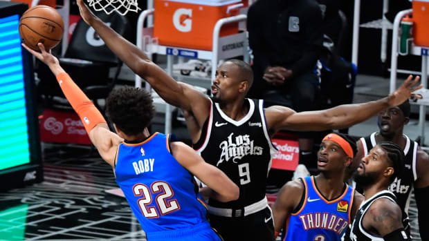 Jan 24, 2021; Los Angeles, California, USA; Oklahoma City Thunder forward Isaiah Roby (22) tries to score past LA Clippers center Serge Ibaka (9) dirge the third quarter at Staples Center. Mandatory Credit: Robert Hanashiro-USA TODAY Sports