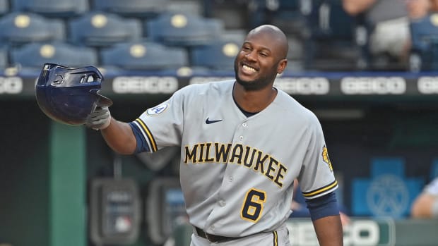 May 18, 2021; Kansas City, Missouri, USA; Milwaukee Brewers center fielder Lorenzo Cain (6) tips his cap to the Kansas City Royals fans during the first inning at Kauffman Stadium. Mandatory Credit: Peter Aiken-USA TODAY Sports