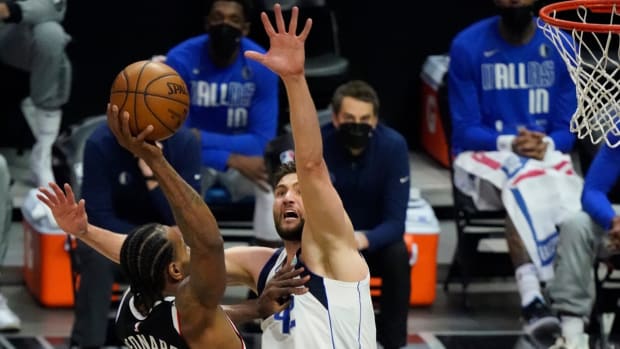 May 22, 2021; Los Angeles, California, USA; LA Clippers forward Kawhi Leonard (2) flies to the basket for a slam dunk over Dallas Mavericks forward Maxi Kleber (42) during the third quarter of game one in the first round of the 2021 NBA Playoffs at Staples Center. Mandatory Credit: Robert Hanashiro-USA TODAY Sports