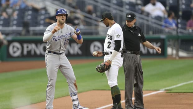 Apr 28, 2021; Pittsburgh, Pennsylvania, USA; Kansas City Royals third baseman Hunter Dozier (17) reacts after hitting a two-run triple against the Pittsburgh Pirates during the first inning at PNC Park. Mandatory Credit: Charles LeClaire-USA TODAY Sports