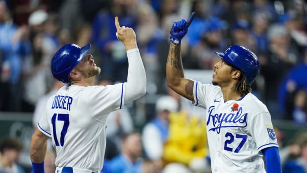 May 31, 2021; Kansas City, Missouri, USA; Kansas City Royals shortstop Adalberto Mondesi (27) celebrates with third baseman Hunter Dozier (17) after hitting a home run against the Pittsburgh Pirates during the fifth inning at Kauffman Stadium. Mandatory Credit: Jay Biggerstaff-USA TODAY Sports