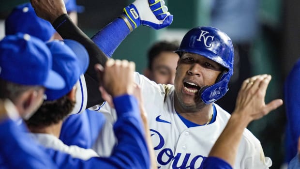 Jun 1, 2021; Kansas City, Missouri, USA; Kansas City Royals catcher Salvador Perez (13) is congratulated by teammates after hitting a home run against the Pittsburgh Pirates during the seventh inning at Kauffman Stadium. Mandatory Credit: Jay Biggerstaff-USA TODAY Sports
