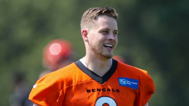 May 25, 2021; Cincinnati, Ohio, USA; Cincinnati Bengals quarterback Joe Burrow (9) runs onto the field during practice at Paul Brown Stadium. Mandatory Credit: Katie Stratman-USA TODAY Sports