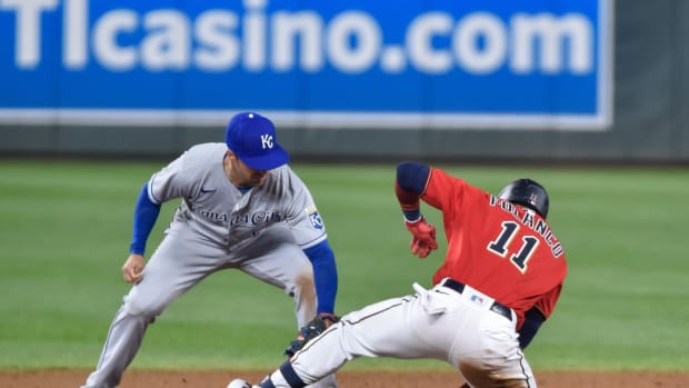 May 28, 2021; Minneapolis, Minnesota, USA; Kansas City Royals second basement Whit Merrifield (15) applies the tag to Minnesota Twins second basemen Jorge Polanco (11) after Polanco hit a double during the ninth inning at Target Field. Mandatory Credit: Jeffrey Becker-USA TODAY Sports