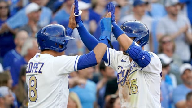 Jun 4, 2021; Kansas City, Missouri, USA; Kansas City Royals second baseman Whit Merrifield (15) celebrates with shortstop Nicky Lopez (8) after after hitting a two run home run in the first inning against the Minnesota Twins at Kauffman Stadium. Mandatory Credit: Denny Medley-USA TODAY Sports