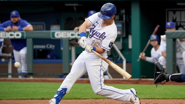 Jun 4, 2021; Kansas City, Missouri, USA; Kansas City Royals left fielder Andrew Benintendi (16) connects for a two run double in the first inning against the Minnesota Twins at Kauffman Stadium. Mandatory Credit: Denny Medley-USA TODAY Sports