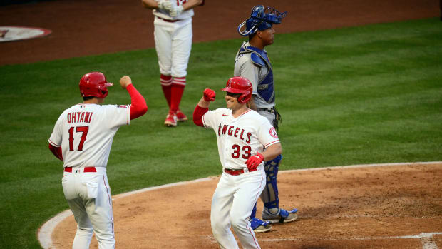 Jun 8, 2021; Anaheim, California, USA; Los Angeles Angels catcher Max Stassi (33) is greeted by designated hitter Shohei Ohtani (17) after hitting a two run home run against the Kansas City Royals during the third inning at Angel Stadium. Mandatory Credit: Gary A. Vasquez-USA TODAY Sports