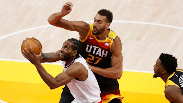 Jun 8, 2021; Salt Lake City, Utah, USA; LA Clippers forward Kawhi Leonard (2) drives to the hoop against Utah Jazz center Rudy Gobert (27) in the fourth quarter during game one in the second round of the 2021 NBA Playoffs. at Vivint Arena. Mandatory Credit: Jeffrey Swinger-USA TODAY Sports