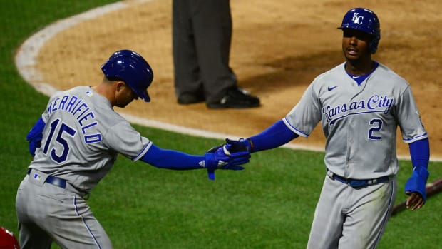 Jun 8, 2021; Anaheim, California, USA; Kansas City Royals center fielder Michael A. Taylor (2) is greeted by second baseman Whit Merrifield (15) after scoring a run against the Los Angeles Angels during the seventh inning at Angel Stadium. Mandatory Credit: Gary A. Vasquez-USA TODAY Sports