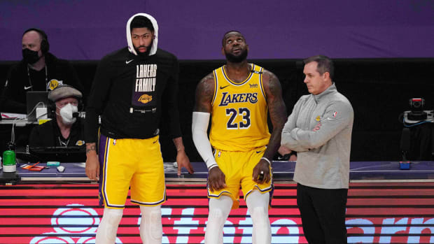 Jun 3, 2021; Los Angeles, California, USA; Los Angeles Lakers forward Anthony Davis (3), forward LeBron James (23) and coach Frank Vogel react in the second half during game six in the first round of the 2021 NBA Playoffs against the Phoenix Suns at Staples Center. Mandatory Credit: Kirby Lee-USA TODAY Sports